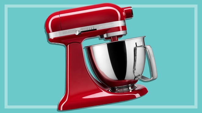 Red KitchenAid stand mixer on a teal background